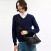 Liten Finn-crossbody-veske med kryssrem og lomme