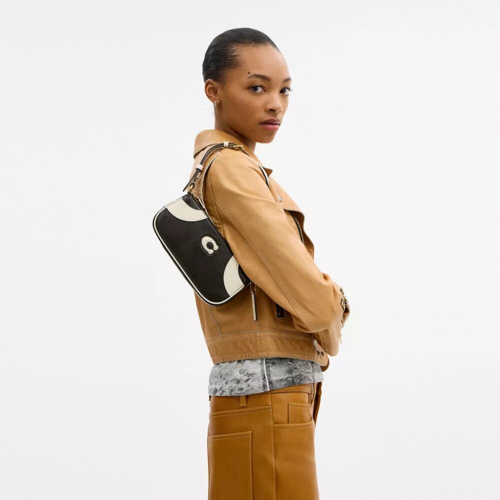 Liten skulderveske i bowlingstil
