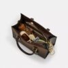 Maggie liten tote-vesker i Ombre Signature Canvas