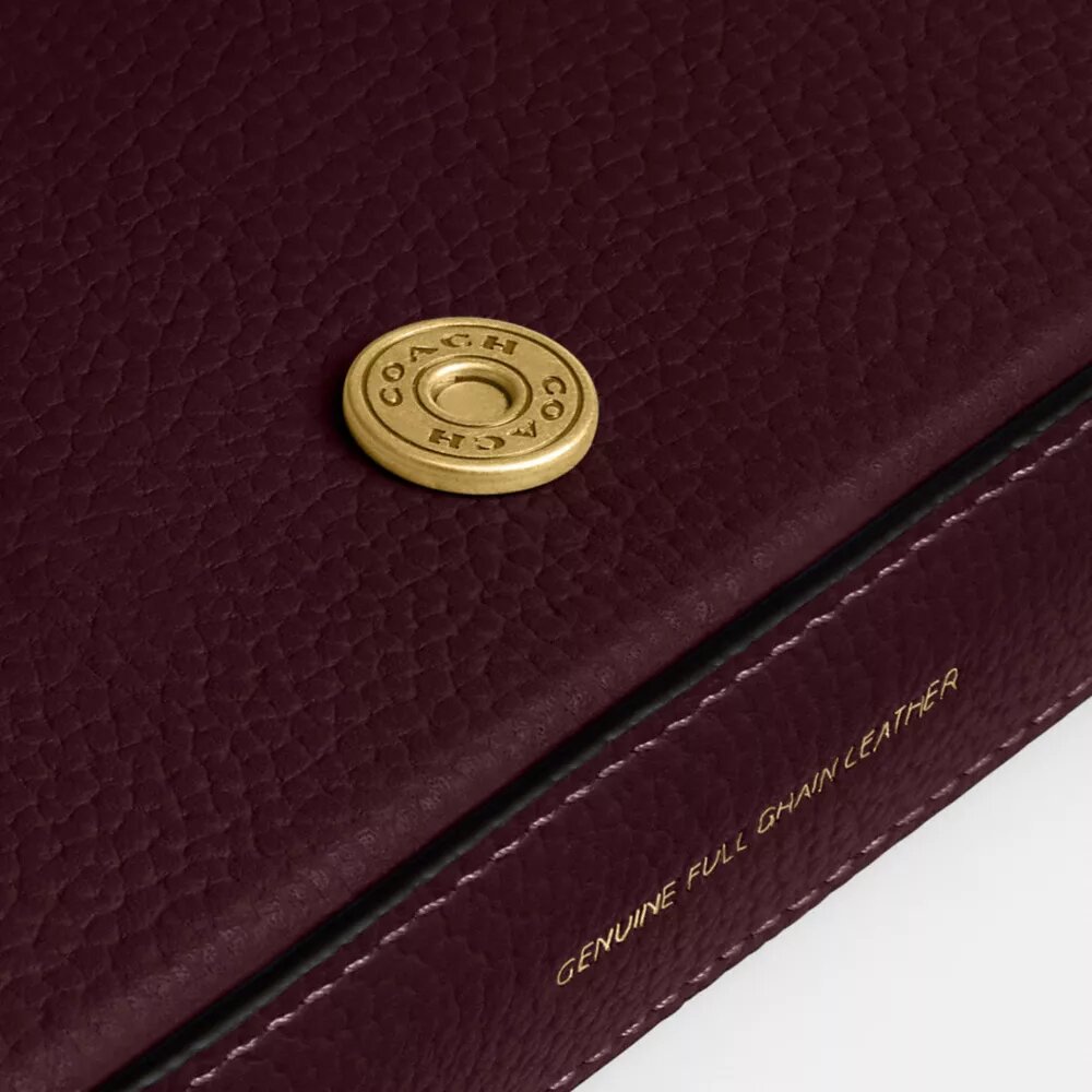 Mila-crossbody-veske med Signature Canvas
