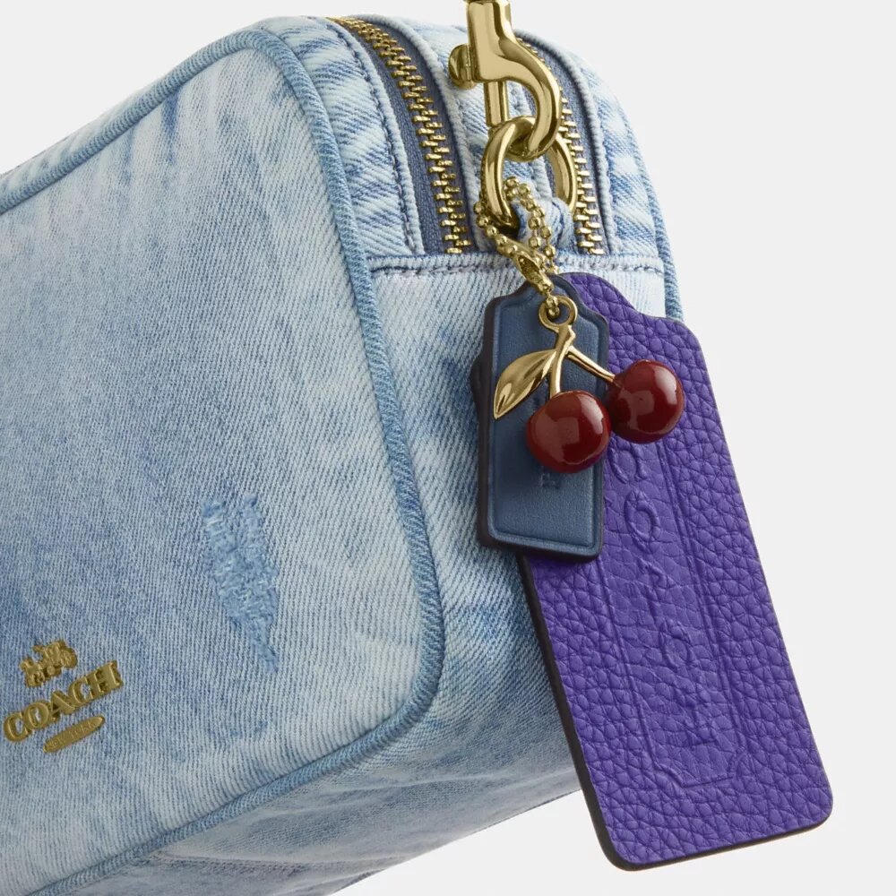 Mini Carey-crossbody-veske i «Loved Denim» med anheng