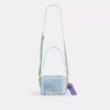 Mini Carey-crossbody-veske i «Loved Denim» med anheng