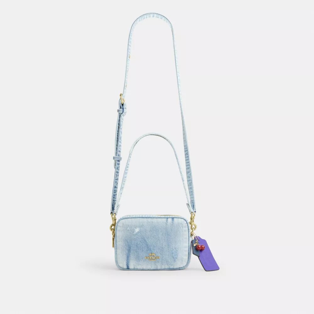 Mini Carey-crossbody-veske i «Loved Denim» med anheng