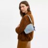 Mini Carey-crossbody-veske i «Loved Denim» med anheng
