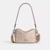 Mini Carey-crossbody-veske i Signature Canvas