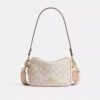 Mini Carey-crossbody-veske i Signature Canvas