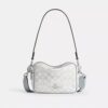 Mini Carey-crossbody-veske i Signature Canvas