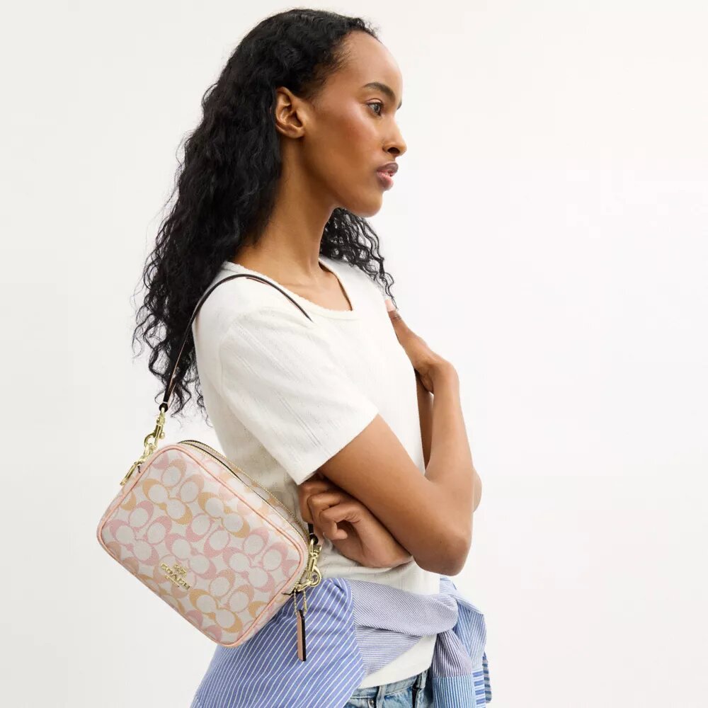 Mini Carey-crossbody-veske i Signature Canvas