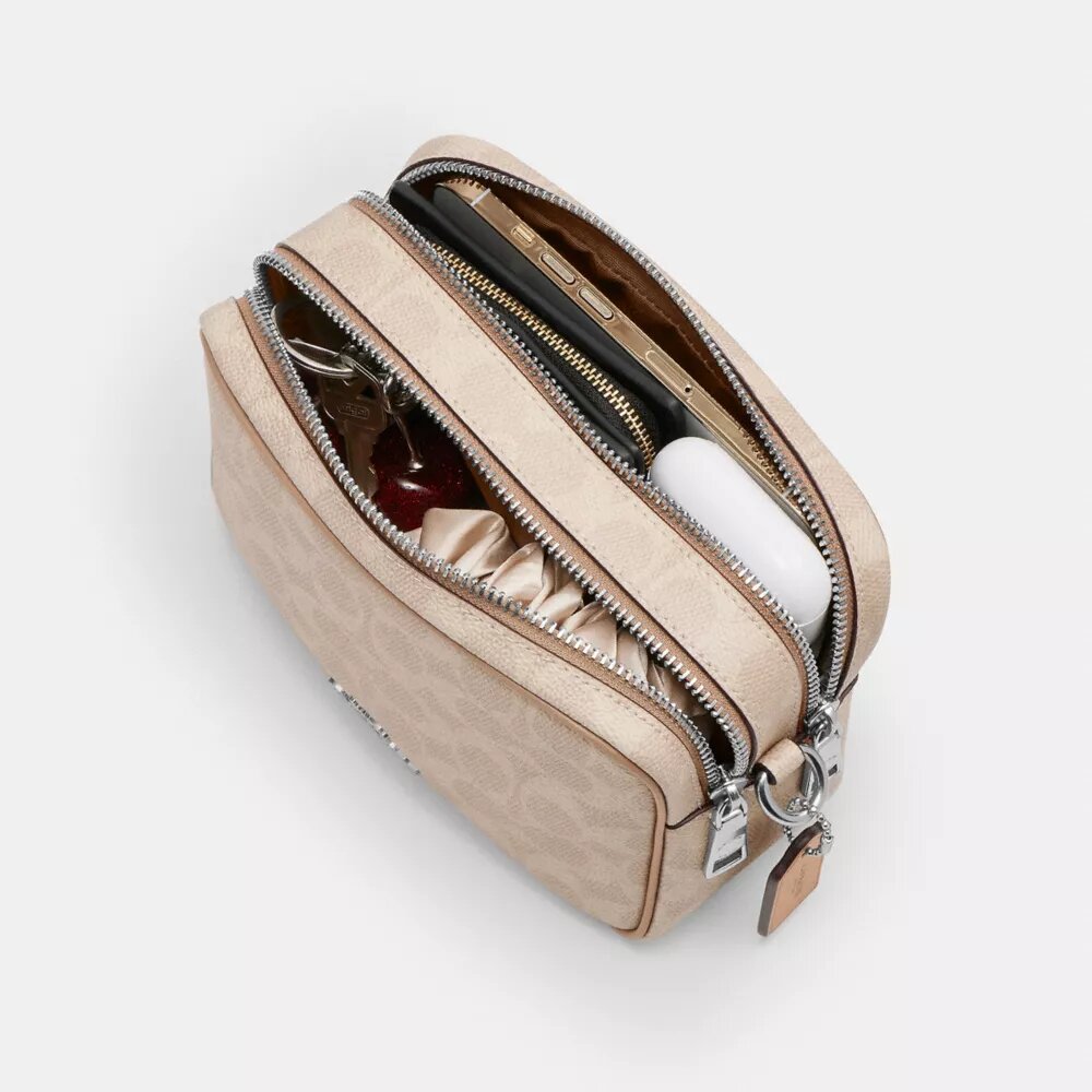 Mini Carey-crossbody-veske i Signature Canvas