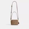 Mini Carey-crossbody-veske i Signature Canvas