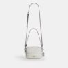 Mini Carey-crossbody-veske i Signature Canvas