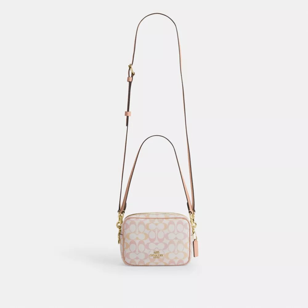 Mini Carey-crossbody-veske i Signature Canvas