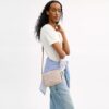 Mini Carey-crossbody-veske i Signature Canvas