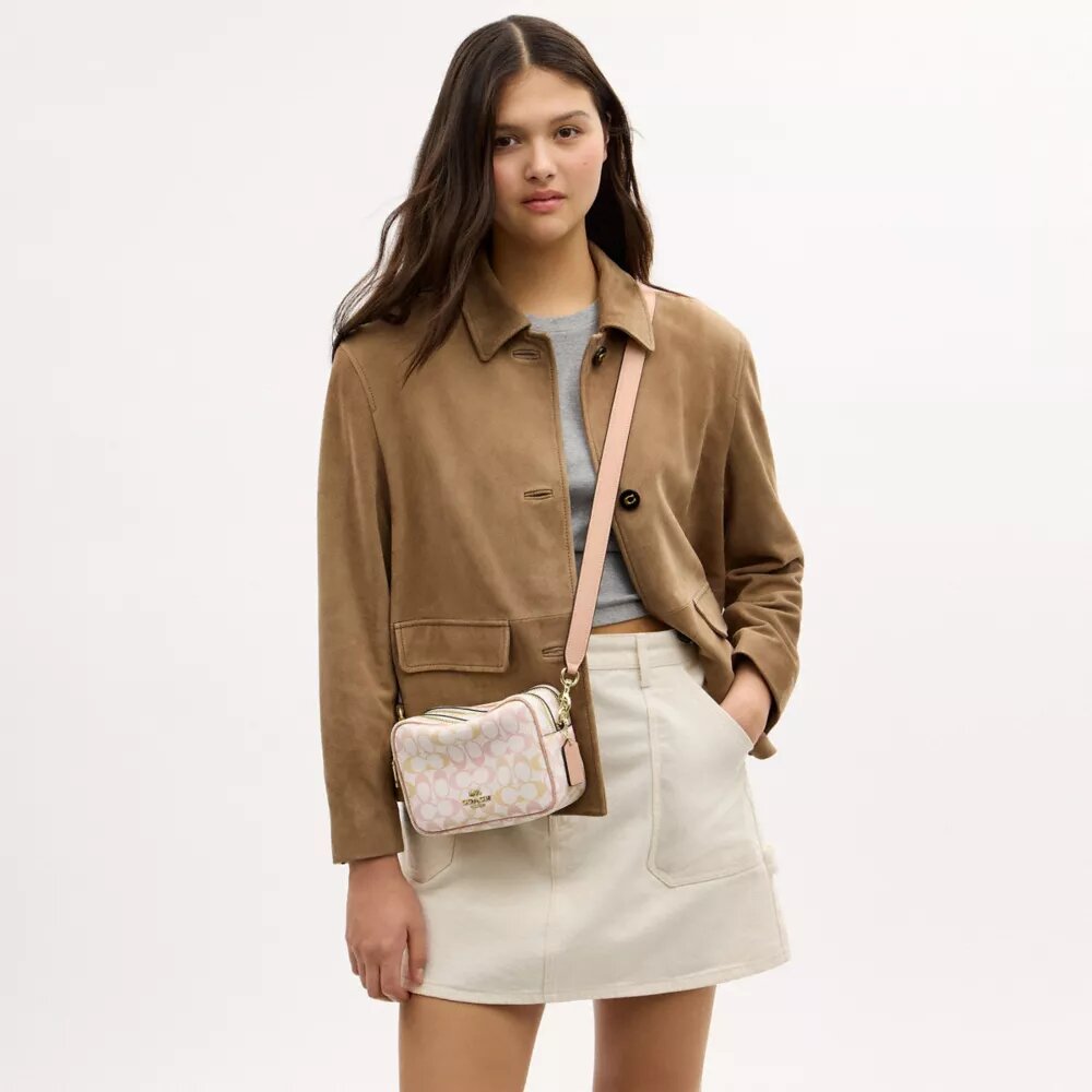 Mini Carey-crossbody-veske i Signature Canvas