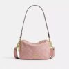 Mini Carey-crossbody-veske i Signature Denim