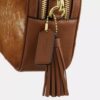 Mini Carey-crossbody-veske med kryssrem i hårkalv med ku-mønster