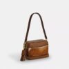 Mini Carey-crossbody-veske med kryssrem i hårkalv med ku-mønster