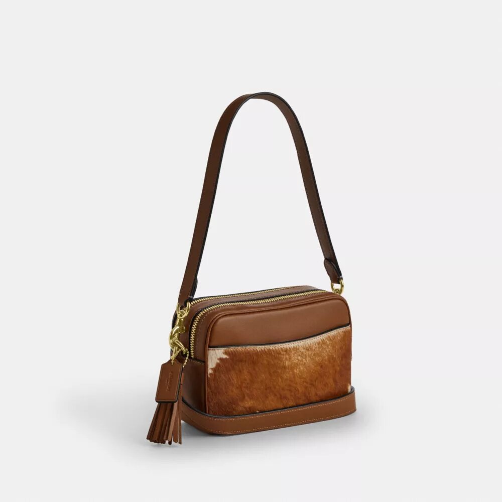 Mini Carey-crossbody-veske med kryssrem i hårkalv med ku-mønster