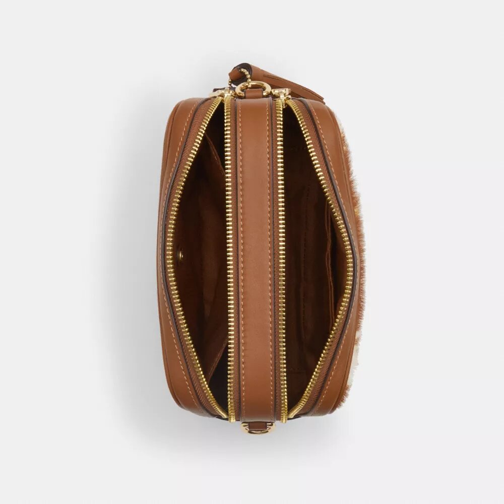 Mini Carey-crossbody-veske med kryssrem i hårkalv med ku-mønster