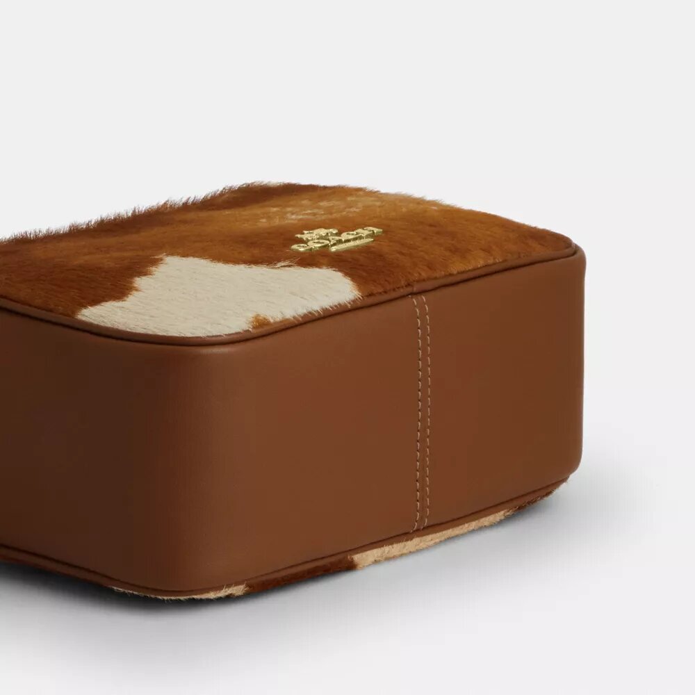 Mini Carey-crossbody-veske med kryssrem i hårkalv med ku-mønster