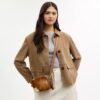 Mini Carey-crossbody-veske med kryssrem i hårkalv med ku-mønster
