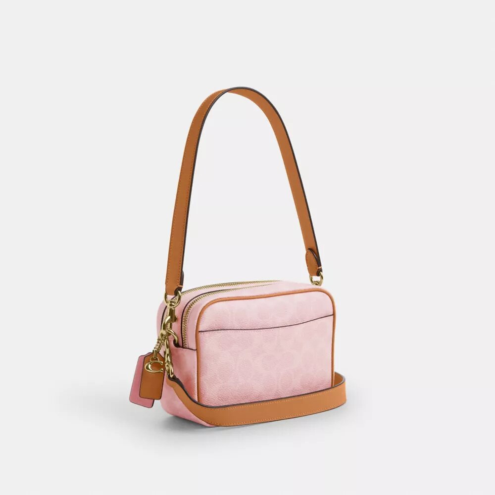 Mini Carey-crossbody-veske med kryssrem i Signature Canvas med anheng