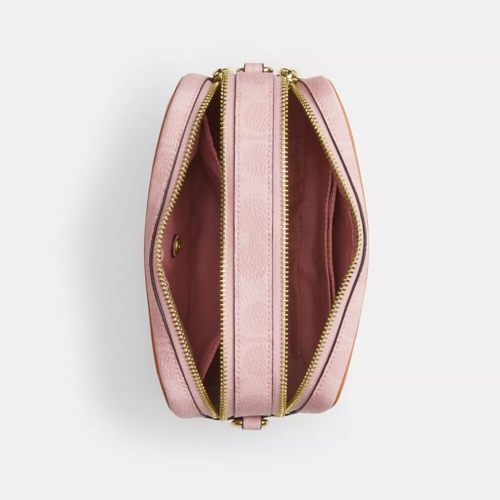 Mini Carey-crossbody-veske med kryssrem i Signature Canvas med anheng