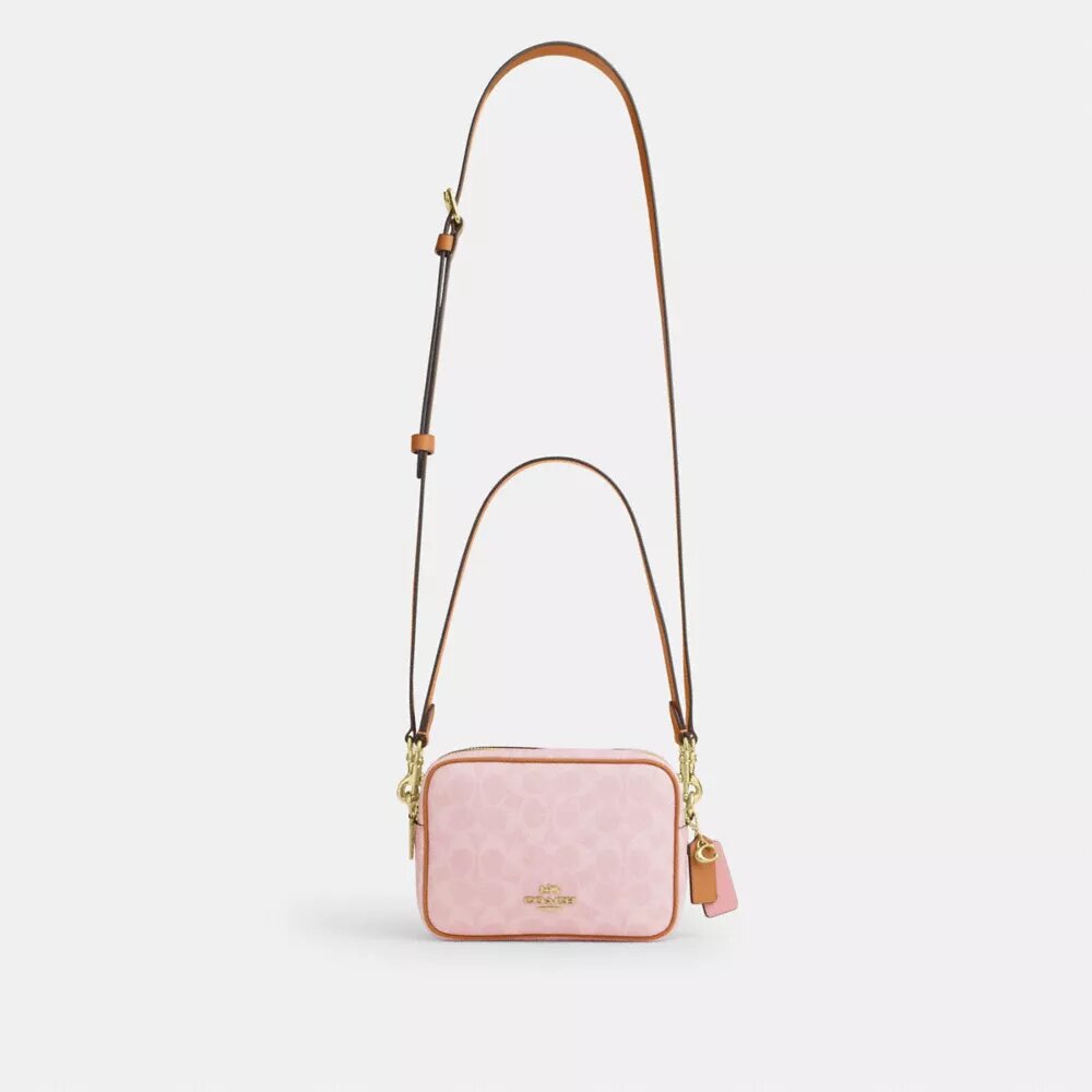 Mini Carey-crossbody-veske med kryssrem i Signature Canvas med anheng
