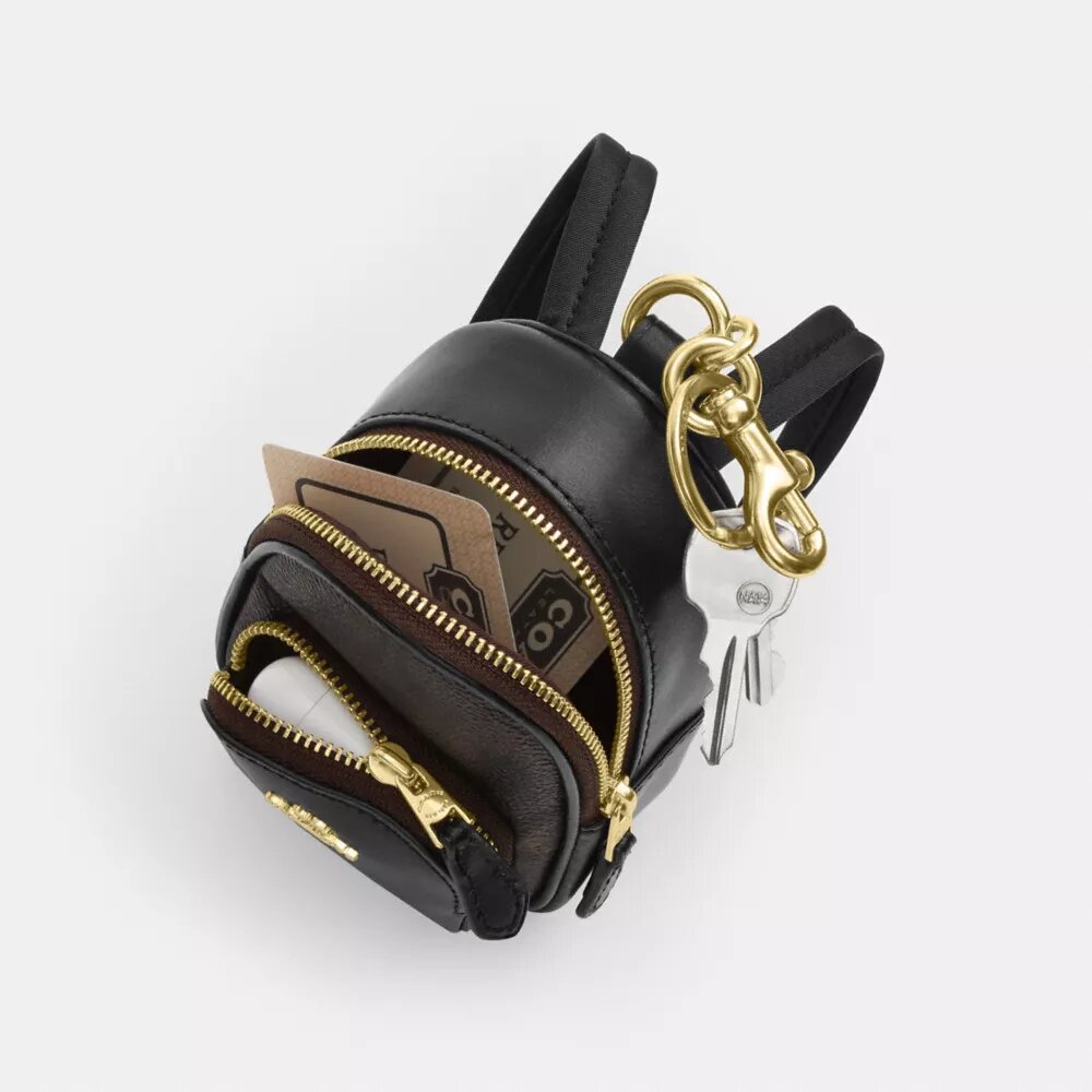 Mini Court Backpack-veskeanheng i Signature Canvas