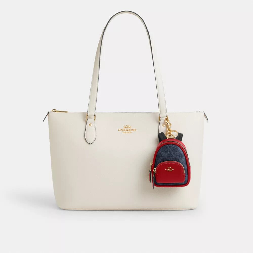 Mini Court Backpack-veskeanheng i Signature Canvas