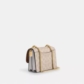 Mini Klare-crossbody-veske i Signature Canvas