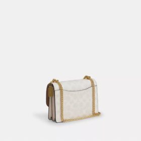 Mini Klare-crossbody-veske i Signature Canvas