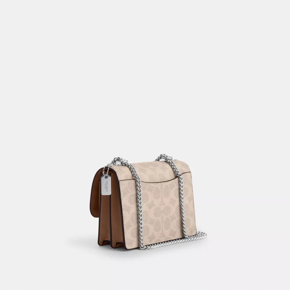 Mini Klare-crossbody-veske i Signature Canvas