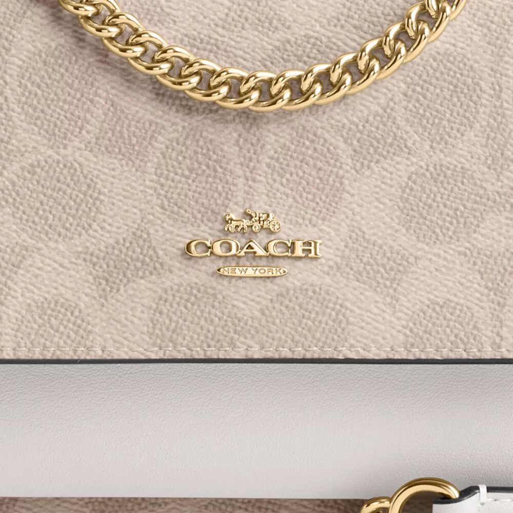 Mini Klare-crossbody-veske i Signature Canvas