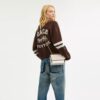 Mini Klare-crossbody-veske i Signature Canvas
