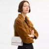 Mini Klare-crossbody-veske i Signature Canvas
