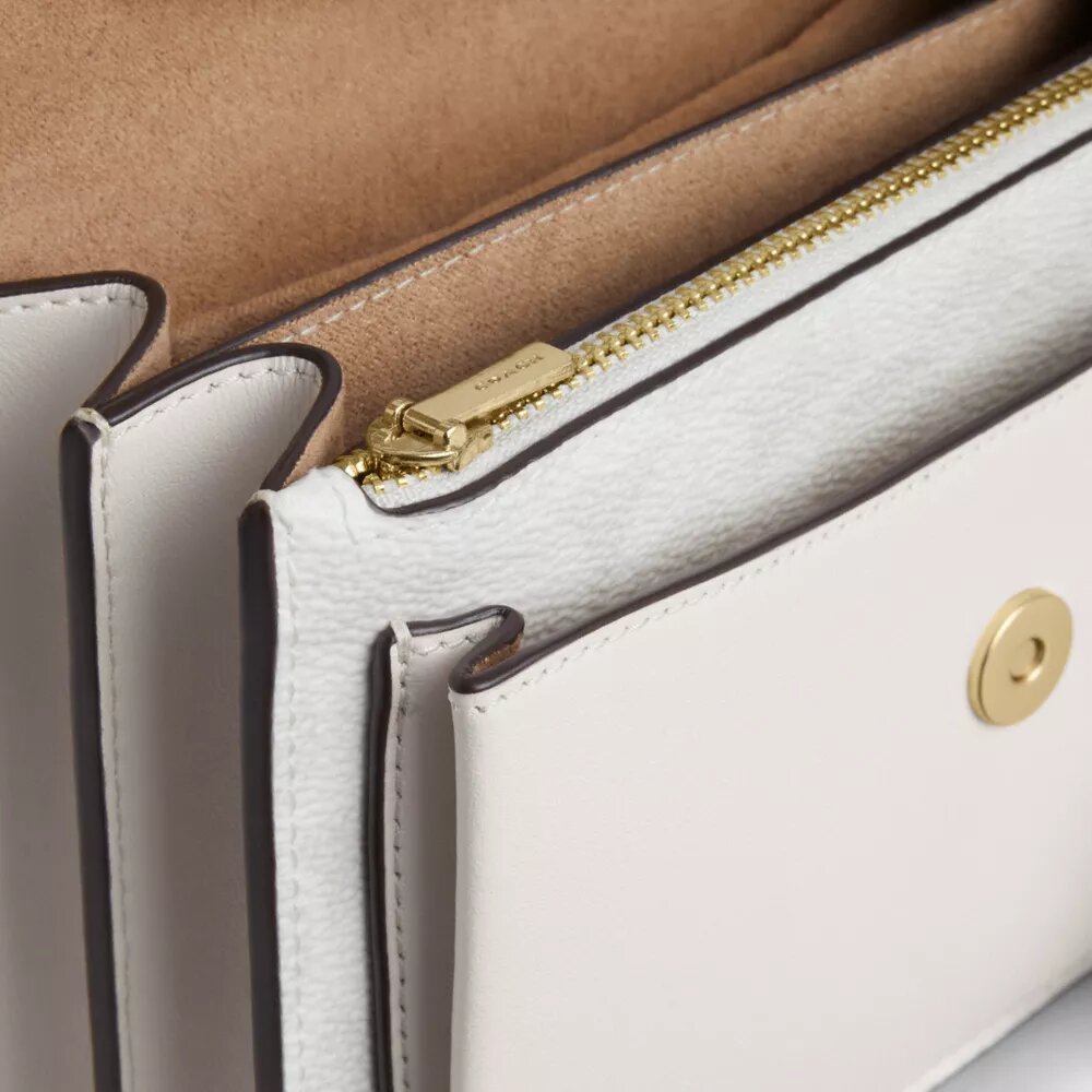 Mini Klare-crossbody-veske i Signature Canvas