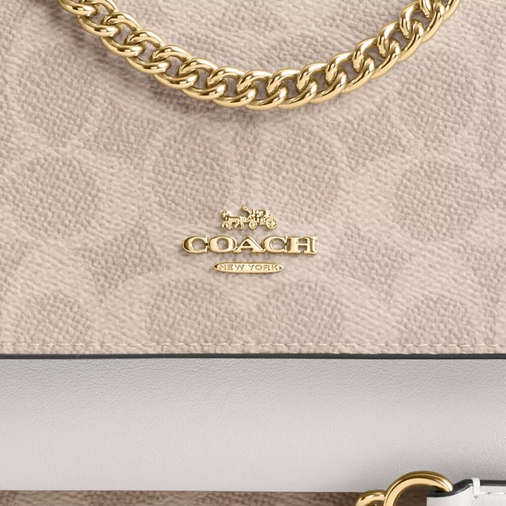 Mini Klare-crossbody-veske i Signature Canvas