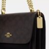 Mini Klare-crossbody-veske i Signature Canvas