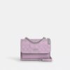 Mini Klare-crossbody-veske i signaturlær