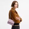 Mini Klare-crossbody-veske i signaturlær