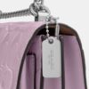 Mini Klare-crossbody-veske i signaturlær