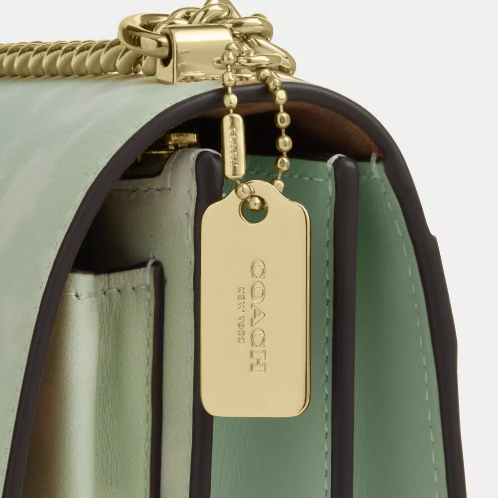 Mini Klare-crossbody-veske med blomstermønster