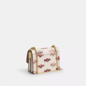 Mini Klare-crossbody-veske med kryssrem og godterimønster