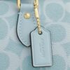 Mini Rowan-crossbody-veske i Signature Canvas