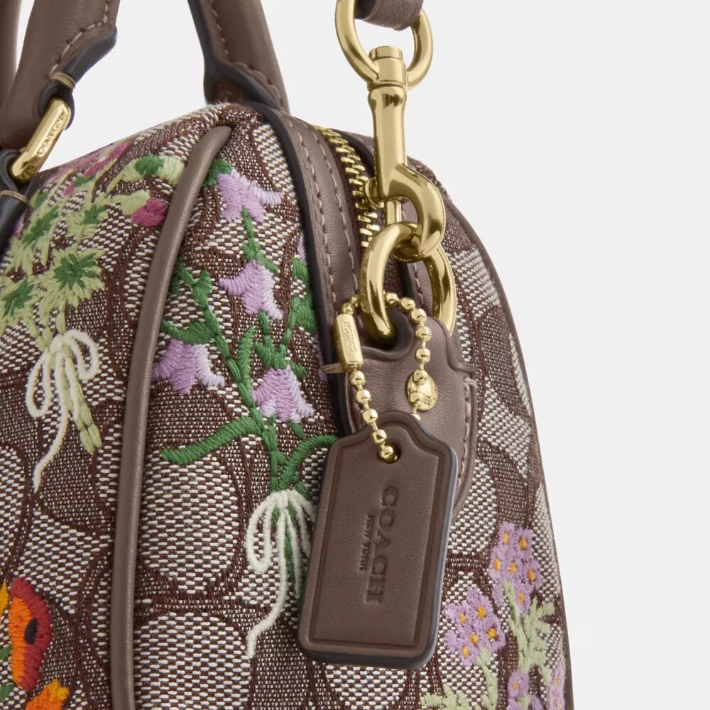 Mini Rowan-crossbody-veske med kryssrem i signaturjacquard med blomsterbroderi