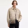Mini Rowan-crossbody-veske med kryssrem i signaturjacquard med blomsterbroderi