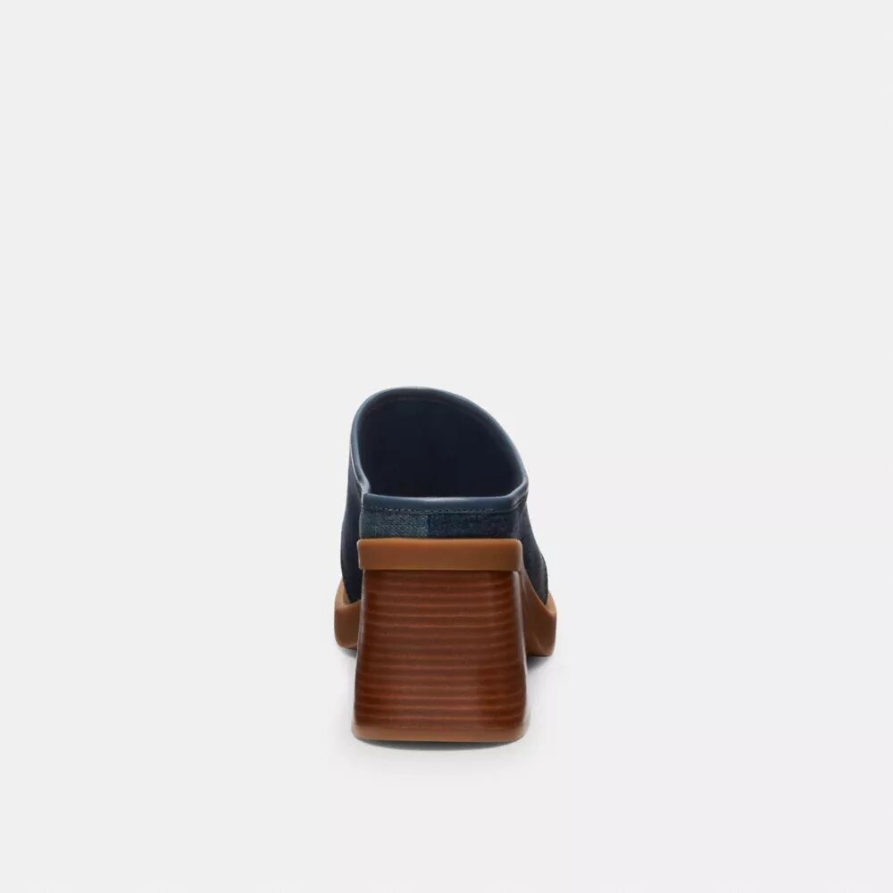Mules med skulpturert C-logo og hæl i «Loved Denim»