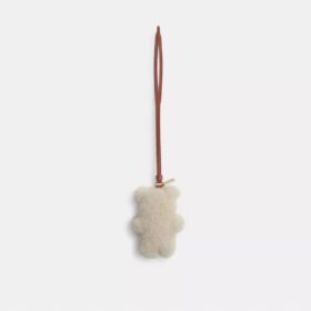 Puffet bjørneveskeanheng i shearling