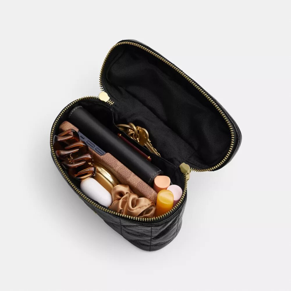 Rainer Crossbody-veske 18 med vattert mønster